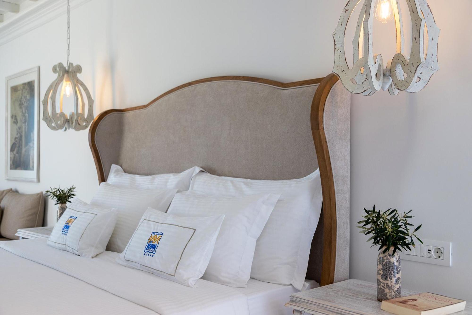 Saint John Hotel Villas & Spa Agios Ioannis Diakoftis Exterior foto A bed with a headboard